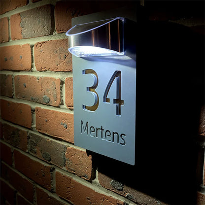 Personalized solar-powered house number sign